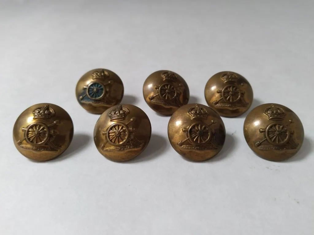 Set of 7 Brass Military Buttons from the Royal Regiment of Artillery, featuring the King's crown and military regalia.