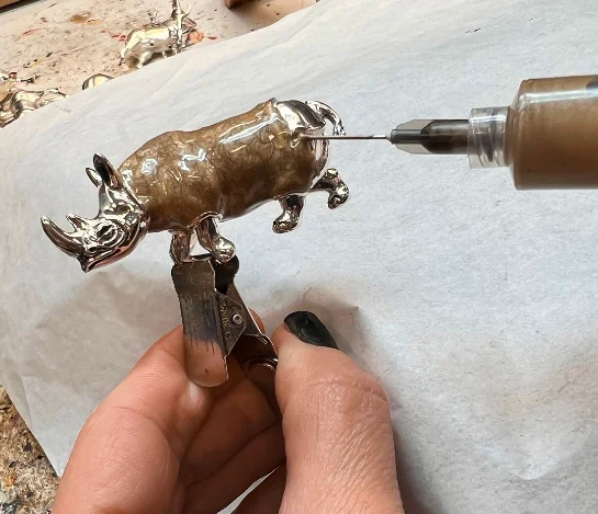 A silver rhino in the enamel process Saturno 182 AR