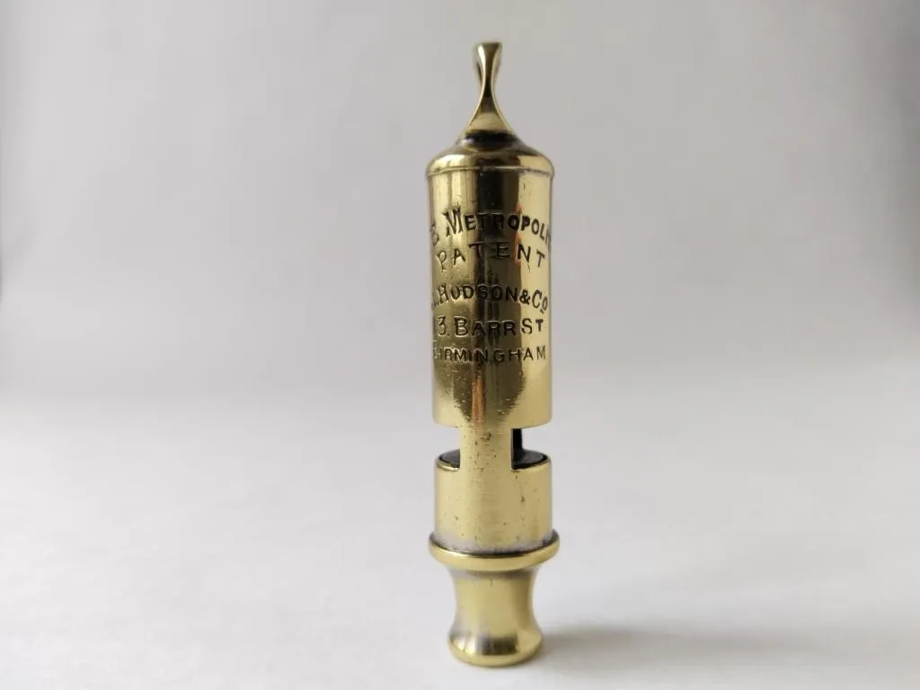 An original ACME Metropolitan Police Whistle from 1889, crafted by J. Hudson & Co., Birmingham—an iconic piece of British law enforcement history.