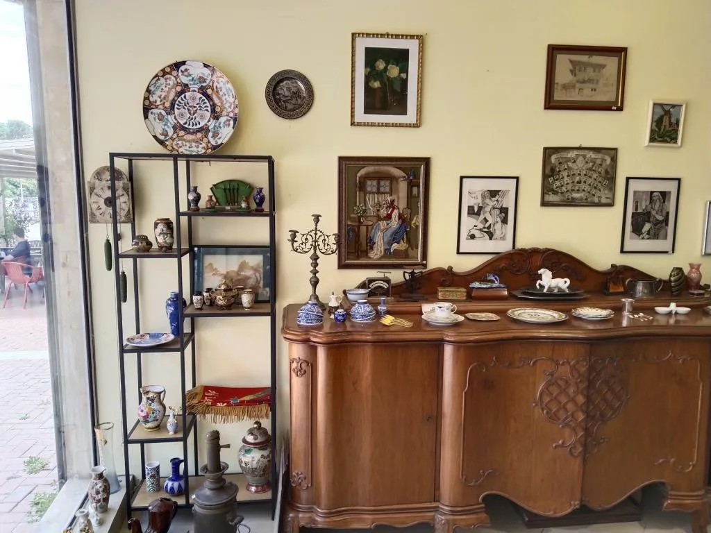 A glimpse of the interior at Antiques & Art Gallery in Varna, showcasing curated Asian art, ceramics, and antique furniture in an elegant display.