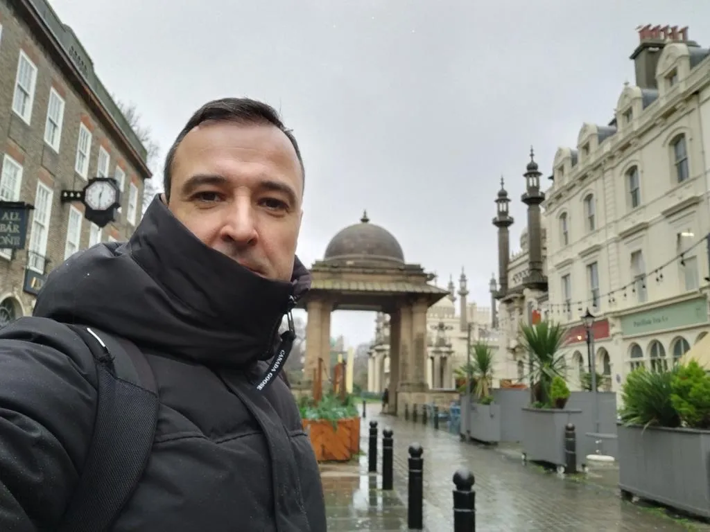 Exploring Brighton with the iconic Brighton Pavilion in the background.