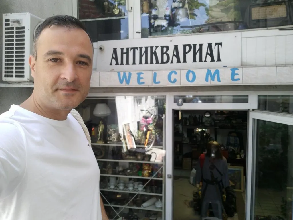 Standing in front of Antiquariat 14, Varna: A welcoming entrance to a world of unique antiques and historical treasures.