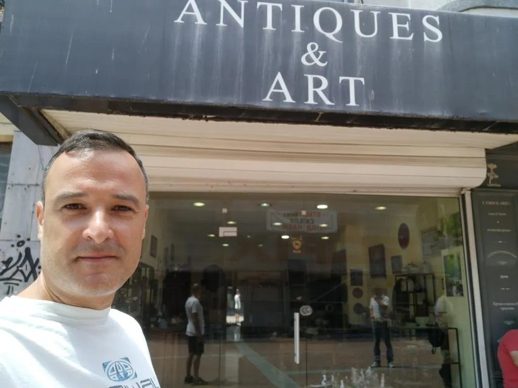 Standing outside the Antiques & Art Gallery in Varna, Bulgaria - where I uncovered rare military buttons from the Third Bulgarian Kingdom and other fascinating treasures.