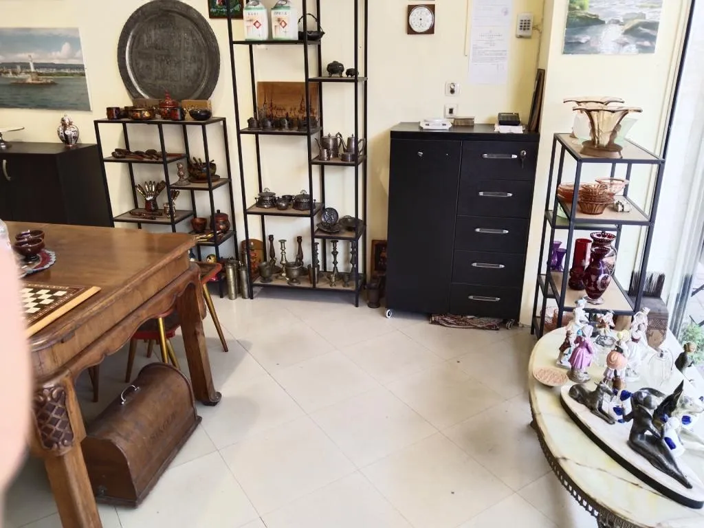 The interior of Antiques & Art Gallery in Varna, showcasing a variety of collectibles, antique furniture, and unique decorative items.