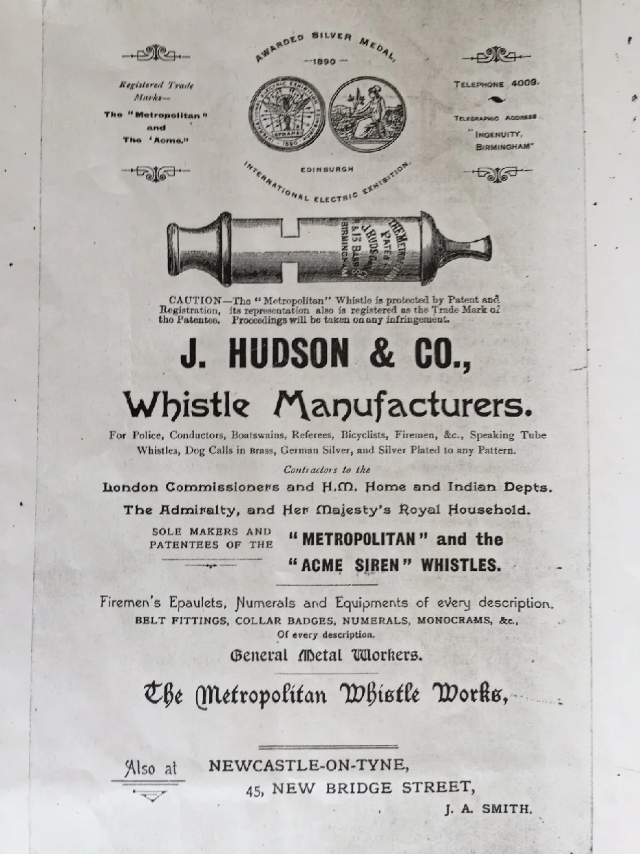 Vintage advertisement for J. Hudson & Co., renowned whistle manufacturers, featuring their famous Metropolitan and Acme Siren whistles. The ad highlights their use in law enforcement, maritime services, and other professional fields, and mentions their official contracts with the British Admiralty and Royal Household. Circa 1900.