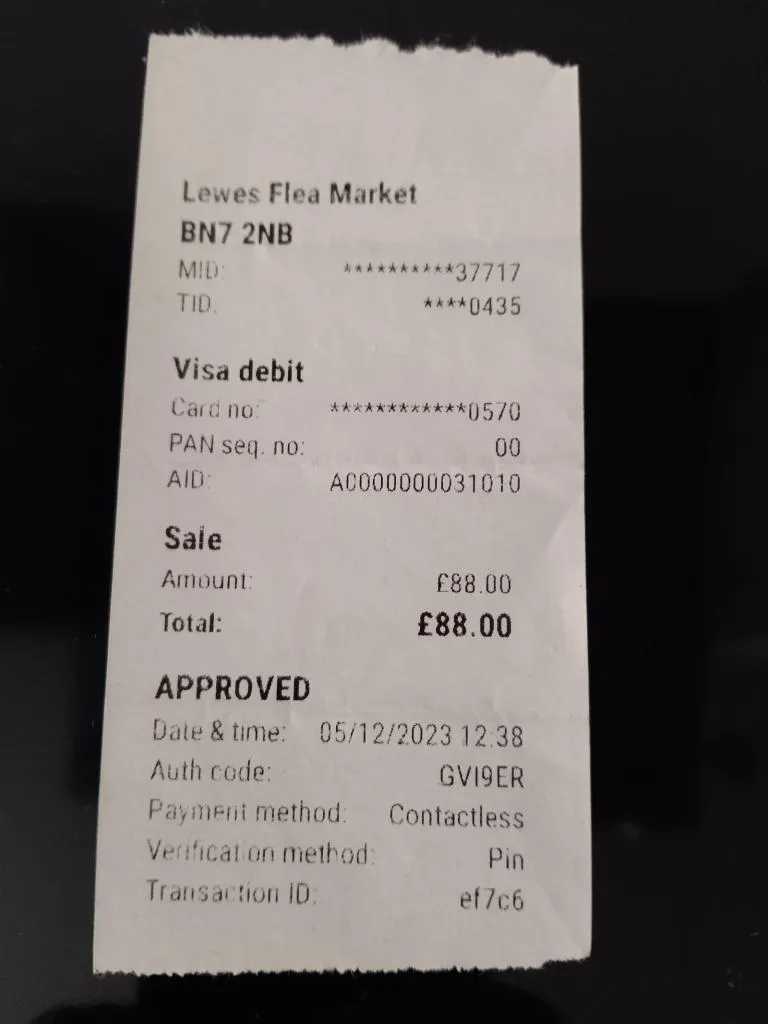 A receipt from Lewes Flea Market showing a payment of £88.00, marking the purchase of rare antiques. The transaction reflects a successful day of treasure hunting in the heart of Lewes.