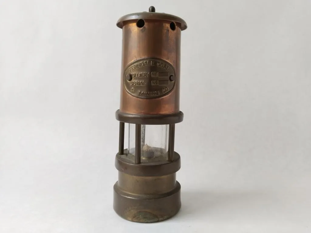 A vintage Ferndale Coal Miners Lamp, a cherished relic from the mining industry.