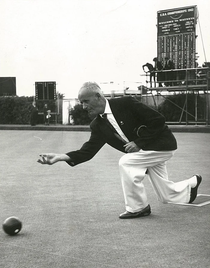 Percy Baker at the green, rolling a lawn bowl on August 8, 1965