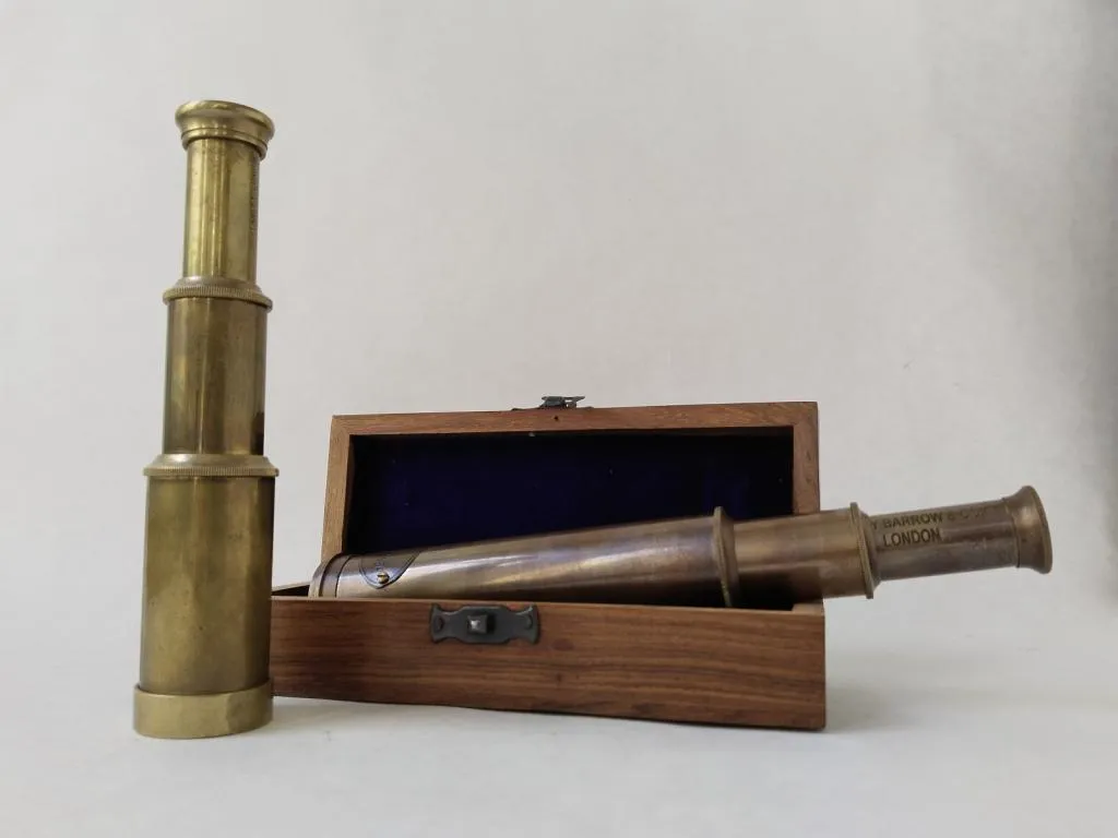 Comparison between the replica Henry Barrow & Co. telescope and a genuine antique Stanley London telescope, highlighting the differences.