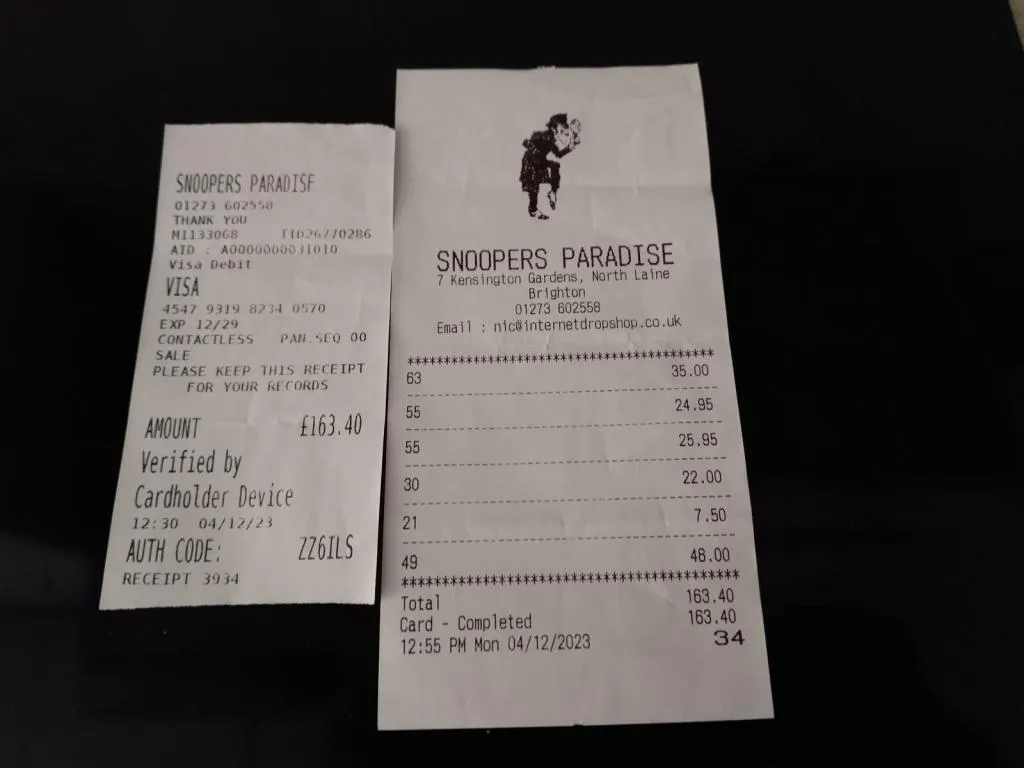 Receipts from Snoopers Paradise showing a card payment for various antique items.